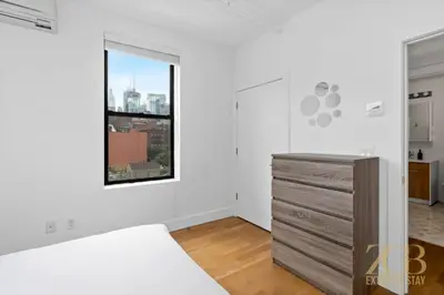 a bedroom with a bed and a window at Fabulous 1 Bedroom in the Heart of Manhattan in New York