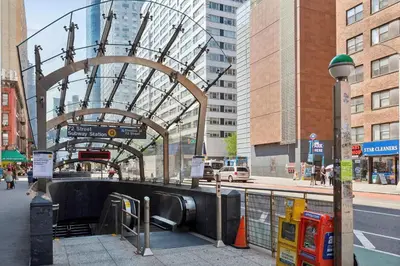 a train station in a city with a tunnel at Stylish 2-Bedroom Apartment in the Upper East Side in New York