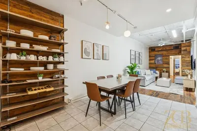 a dining room with a table and chairs at Spacious 3BR Flex 4 with Washer & Dryer in NoMad in New York