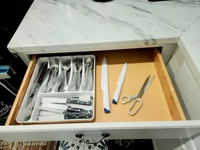 a drawer with scissors and other kitchen utensils at Cozy 2BR in Newark for Families, Work & Long Stays in Newark