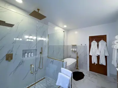 a bathroom with a shower and a sink at The Pink Haus
