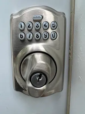 a metal door lock with a bunch of buttons on it at Cozy Studio Apartment in Montgomery