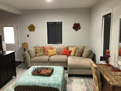 a living room with a couch and a table at Cozy Studio Apartment in Montgomery