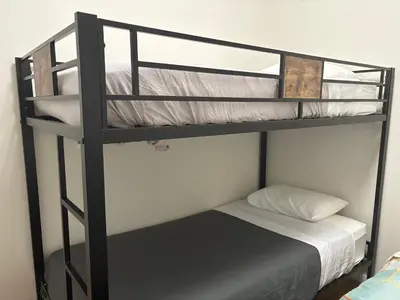 two bunk beds in a room with a bed at Signature by Times Square in New York