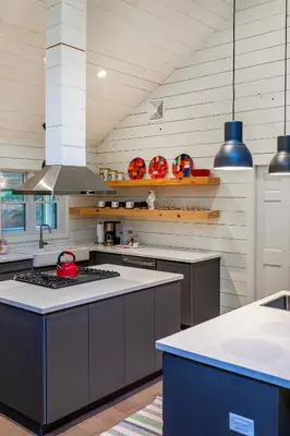 a kitchen with a stove top oven in a room at Hare & Hollow with Hot Tub & Fenced Yard