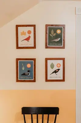a wall with four pictures of birds on it at Creekfront Cabin Sauna & Hot Tub Hikers Hollow in Cuddebackville