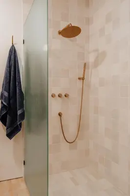 a shower stall with a glass door with a shower at Onyx Ridge Breathtaking Views 14 Acres in Jeffersonville