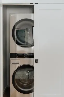 a washing machine and a microwave in a kitchen at Onyx Ridge Breathtaking Views 14 Acres in Jeffersonville
