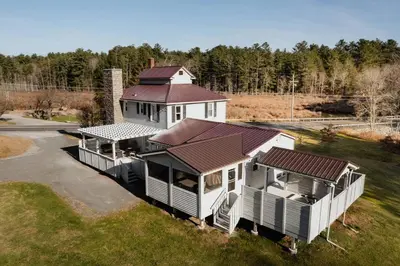 an overhead view of a house with a roof at Swan Pond Cabin Hot Tub & Firepit Retreat in Swan Lake
