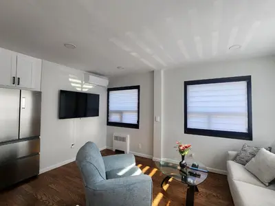 a living room with a couch and a table at Modern & Tranquil Apartment in Bogota