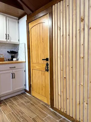 a kitchen with a wooden door in a kitchen at King Cabin