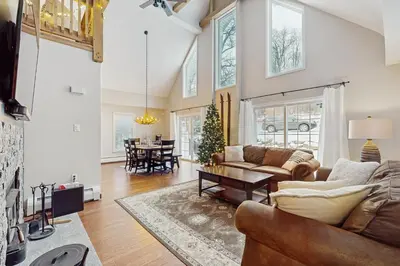 a living room with a couch and a table at Buckboard Haven in Dover