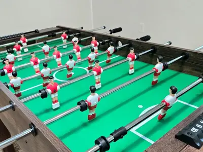a group of people playing a game of billiards at Best house in town in Latham