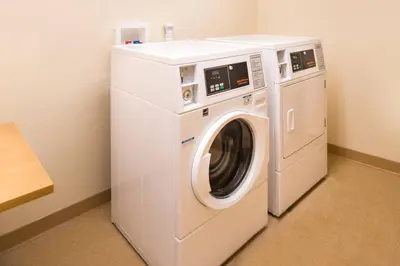 a white washer and dryer in a room at Fairfield Inn & Suites by Marriott Utica in Utica