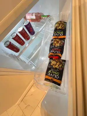 an open refrigerator with some food and drinks in it at Home in West Haven