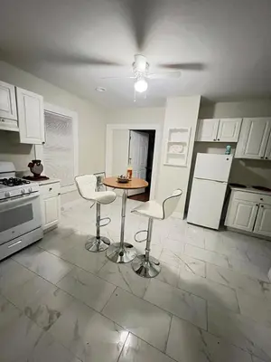 a kitchen with a table and chairs in it at Home in West Haven