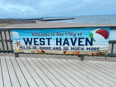 a welcome to the city of westhaven sign on a boardwalk at Home in West Haven