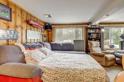 a living room with a couch and chairs in a house at Hike and Explore Western Mass Peaceful Studio in Palmer