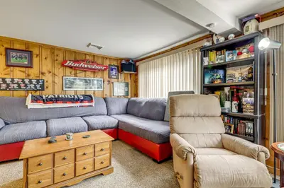 a living room with a couch and a table at Hike and Explore Western Mass Peaceful Studio in Palmer