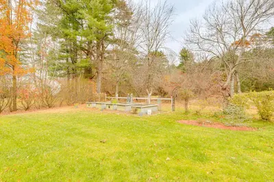a park with a bench in the middle of a field at Hike and Explore Western Mass Peaceful Studio in Palmer