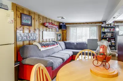 a living room with a couch and a table at Hike and Explore Western Mass Peaceful Studio in Palmer