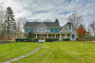 a house with a green lawn in front of it at Pond and Gazebo Expansive Hudson Valley Escape! in Goshen