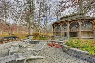 a gazebo and two chairs in a park at Pond and Gazebo Expansive Hudson Valley Escape! in Goshen