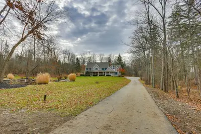 a driveway leading to a house in the woods at Pond and Gazebo Expansive Hudson Valley Escape! in Goshen