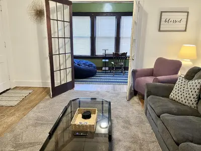 a living room with a couch and a table at Binghamton Hospitals Private Room Shared Spaces Trades Medical Staff Welcom in Binghamton