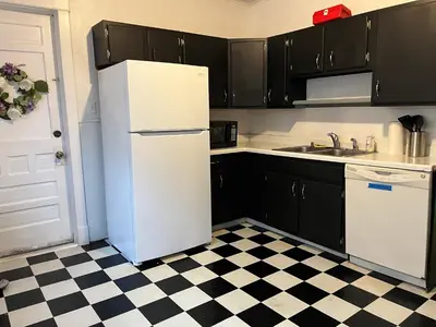 a white refrigerator in a kitchen with a checkered floor at NightShiftReady Binghamton Trades Nurses Welcome Private Room in Shared Apartment in Binghamton