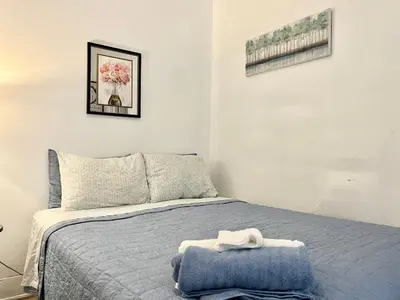 a bedroom with a bed with a blue blanket at NightShiftReady Binghamton Trades Nurses Welcome Private Room in Shared Apartment in Binghamton