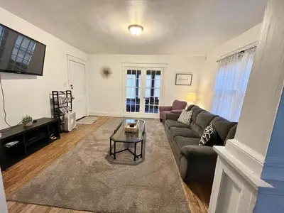 a living room with a couch and a table at Affordable for Crews Binghamton Close to Job Sites in Binghamton