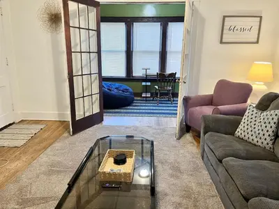 a living room with a couch and a table at Affordable for Crews Binghamton Close to Job Sites in Binghamton