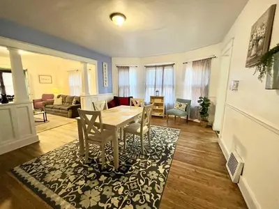 a living room with a table and chairs at Affordable for Crews Binghamton Close to Job Sites in Binghamton