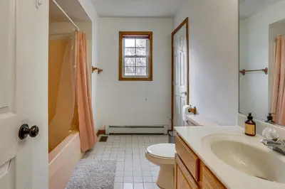 a bathroom with a sink and a toilet and a tub at Hike, Ski and Game Spacious Poconos Home with Yard in Tobyhanna