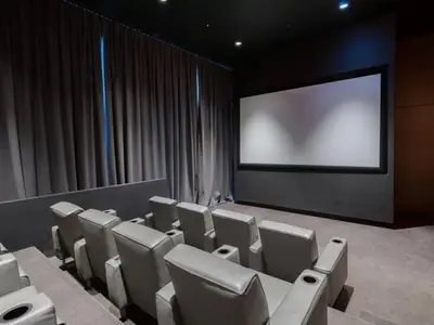 a conference room with chairs and a projection screen at 685 First Ave in New York