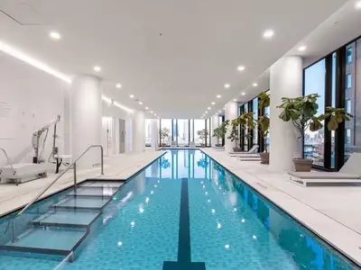 a swimming pool in a building with windows at 685 First Ave in New York