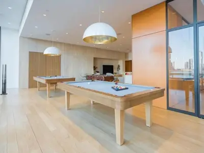a billiard room with two pool tables in it at 685 First Ave in New York