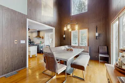 a kitchen and dining room with a table and chairs at Deer Hill Retreat in Whitingham