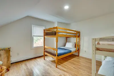 a bedroom with two bunk beds and a window at 7 Mi to The Walkway Hudson Valley Adventure Base in Highland