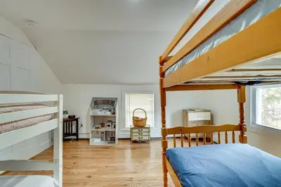 a bedroom with a bunk bed and a staircase at 7 Mi to The Walkway Hudson Valley Adventure Base in Highland