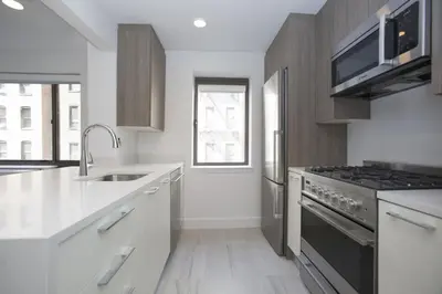 a kitchen with a sink and a stove top oven at Cameo in New York