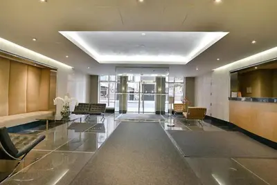 a lobby of a building with chairs and tables at Cameo in New York