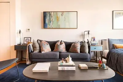 a living room with a couch and a coffee table at Beautiful Modern Studio in Luxury Building in Brooklyn