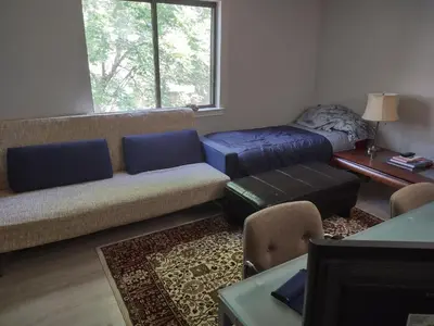 a living room with a couch and a table at Farmington Guest Housing in Farmington