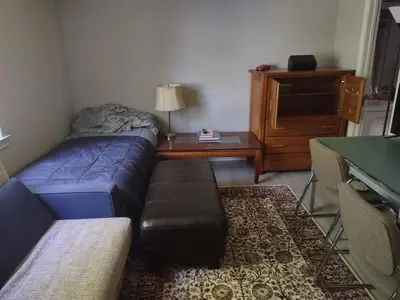a living room with a couch and a table at Farmington Guest Housing in Farmington