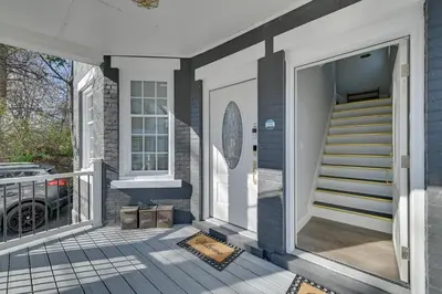 a front porch of a house with a staircase at Walk to Park Modern Apt 2 Mi to Union College! in Schenectady