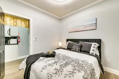 a bedroom with a bed in a room at Walk to Park Modern Apt 2 Mi to Union College! in Schenectady