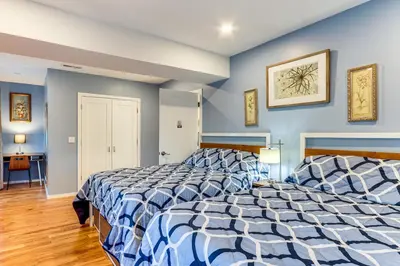 two beds in a room with blue walls at 6 Mi to Dtwn New Haven Duplex with Shared Yard in West Haven