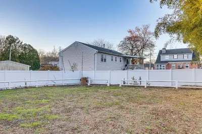 a white fence in front of a house at 6 Mi to Dtwn New Haven Duplex with Shared Yard in West Haven